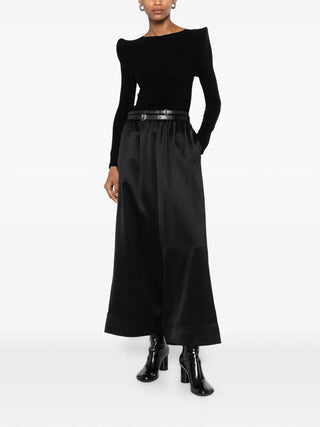Junya Watanabe black satin wide-leg trousers with double belt detail and elasticated waist, available at our Lisbon store.