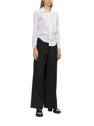 Junya Watanabe white cotton Peter Pan collar shirt with chest pocket and long sleeves — available at our Lisbon store.