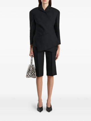 Black KHAITE wrap blazer jacket in a tailored fit with long sleeves. Timeless and versatile, available at our Lisbon store.