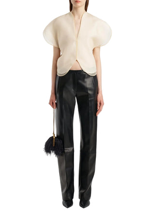 KHAITE Briar top. Silk organza, sculptural sleeves, and a notched V-neck. Made in Italy. A modern statement piece, available at our Lisbon store. 