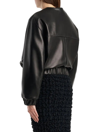 KHAITE Cordan jacket. A reimagined bomber in soft nappa leather. Cropped, rounded silhouette with signature armhole seaming and elasticated trims. 