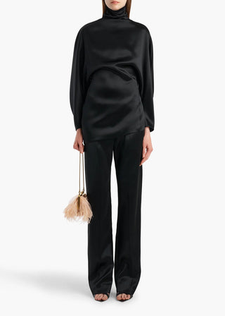 KHAITE Hunter tailored trousers. Italian virgin wool and cashmere blend in a straight-leg fit. A signature silhouette with a concealed front fastening. 