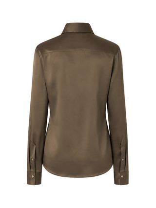 KHAITE Ivy long-sleeve shirt. Elegant high collar, buttoned front, and clean lines. A refined staple, available at our Lisbon store. 