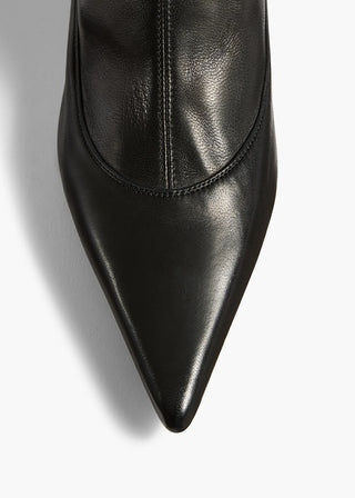 KHAITE's Valerie Mid-Calf Boots: sleek lines, sculpted heel. A refined silhouette that anchors every look with downtown polish. Available at our Lisbon store. 
