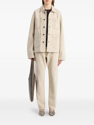 KHAITE Wyatt jacket in beige, crafted from 100% cotton with a relaxed fit. A versatile layer, available at our Lisbon store.