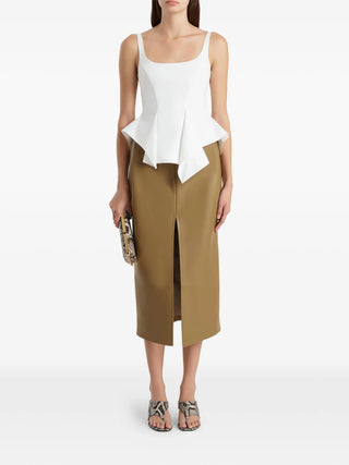 Khaite white sleeveless top with adjustable straps. Refined, versatile, and effortlessly elegant. Available at our Lisbon store.