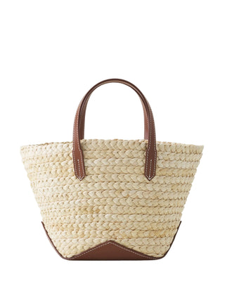 Woven straw handbag with brown leather handles by Lavin