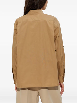 MAX MARA flap-pocket cotton shirt. Classic collar, concealed button front, and two chest flap pockets. Available at our Lisbon store.