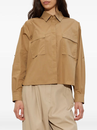 MAX MARA flap-pocket cotton shirt. Classic collar, concealed button front, and two chest flap pockets. Available at our Lisbon store.
