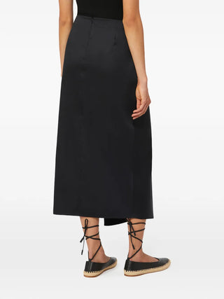 Max Mara midi skirt with exquisite waist knotting. Luxurious satin, linen, or silk blend. A timeless Italian investment piece. Available at our Lisbon store.