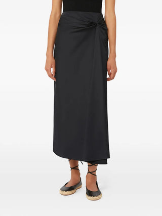 Max Mara midi skirt with exquisite waist knotting. Luxurious satin, linen, or silk blend. A timeless Italian investment piece. Available at our Lisbon store.