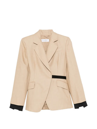 Mxsfionda blazer in pure linen. Double-breasted silhouette with black trim, removable cuffs, and Italian craftsmanship. Available at our Lisbon store.