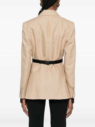 Mxsfionda blazer in pure linen. Double-breasted silhouette with black trim, removable cuffs, and Italian craftsmanship. Available at our Lisbon store.