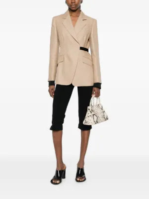 Mxsfionda blazer in pure linen. Double-breasted silhouette with black trim, removable cuffs, and Italian craftsmanship. Available at our Lisbon store.
