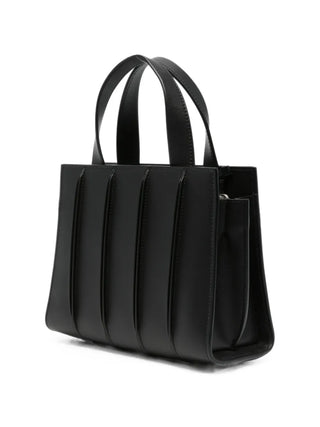 Paneled leather tote bag by Max Mara. Crafted from smooth calfskin. Features top handles, a detachable shoulder strap, and internal pockets. 