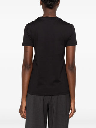 Max Mara Papaia T-shirt. Embroidered pocket, pure cotton, and timeless style. An elevated basic available at our Lisbon store. 