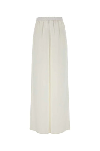 Max Mara wide-leg trousers. Fluid palazzo silhouette, front pleats, and impeccable Italian craftsmanship. Timeless elegance, available at our Lisbon store. 