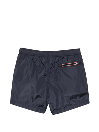 Moncler Boxer Mare swim shorts. 100% polyamide with logo patch, elastic drawstring, side and rear pockets. Quick-drying luxury, available at our Lisbon store.