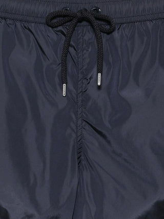 Moncler Boxer Mare swim shorts. 100% polyamide with logo patch, elastic drawstring, side and rear pockets. Quick-drying luxury, available at our Lisbon store.
