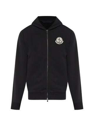 Moncler logo-patch zip-up hoodie. 100% cotton with signature logo patch at chest. A timeless essential,  available at our Lisbon store.