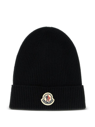 Moncler ribbed beanie. Ribbed knit for supreme warmth and comfort. Finished with the iconic felt Moncler patch. Made in Italy. Available at our Lisbon store.