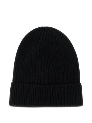 Moncler ribbed beanie. Ribbed knit for supreme warmth and comfort. Finished with the iconic felt Moncler patch. Made in Italy. Available at our Lisbon store.