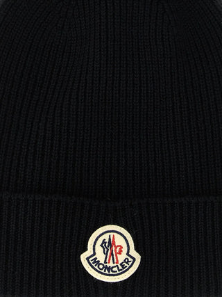 Moncler ribbed beanie. Ribbed knit for supreme warmth and comfort. Finished with the iconic felt Moncler patch. Made in Italy. Available at our Lisbon store.