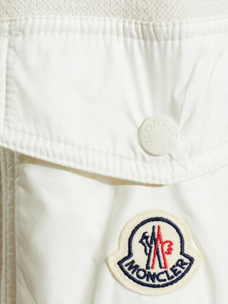 Moncler sweater with sleeve pocket and logo patch. Crewneck, soft wool, and refined utility. A modern essential. Available at our Lisbon store.
