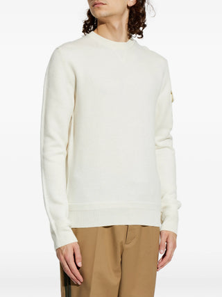 Moncler sweater with sleeve pocket and logo patch. Crewneck, soft wool, and refined utility. A modern essential. Available at our Lisbon store.