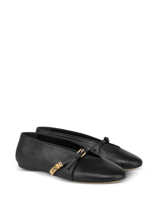 Moschino black logo-lettering ballet flats with buckle strap. A polished everyday flat, available at our Lisbon store.
