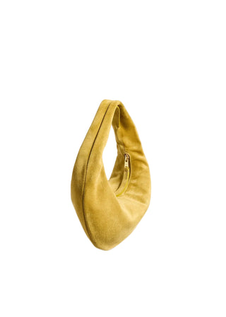 The Olivia Mini Hobo by KHAITE. Buttery leather, a compact curved silhouette, and a vivid yellow finish. This statement bag is available at our Lisbon store. 