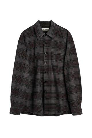 The Above shirt from Our Legacy. A refined, slightly oversized button-down with a chest pocket and mother of pearl buttons. Available at our Lisbon store. 