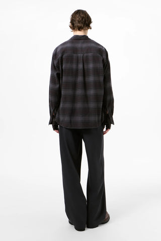 The Above shirt from Our Legacy. A refined, slightly oversized button-down with a chest pocket and mother of pearl buttons. Available at our Lisbon store. 