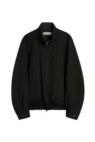 Our Legacy Casino Drape Twill jacket. A boxy silhouette in fluid Tencel™-polyamide twill with a funnel neck and two-way zip. Available at our Lisbon store.