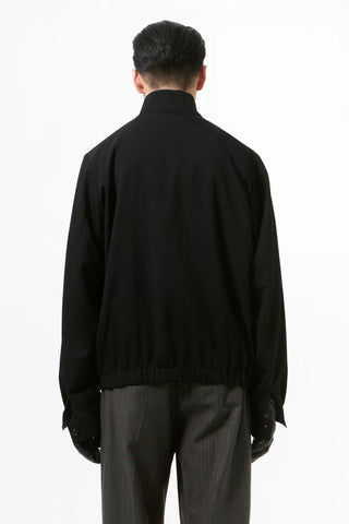 Our Legacy Casino Drape Twill jacket. A boxy silhouette in fluid Tencel™-polyamide twill with a funnel neck and two-way zip. Available at our Lisbon store.