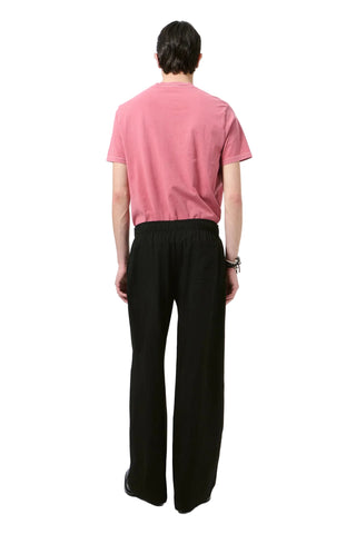Our Legacy Leisure Trouser. Featuring an elasticated waistband, front pleats and wide-leg silhouette. Comfortable dress trousers, available at our Lisbon store.