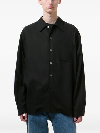 Our Legacy Every Shirt in black with chest pocket and button fastening. A versatile essential, available at our Lisbon store.