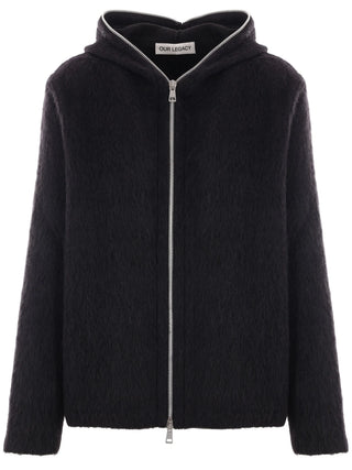 Our Legacy black hairy wool full zip hood with relaxed fit and silver-tone hardware. A modern layer, available at our Lisbon store.