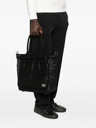 PORTER Tanker Quilted Tote Bag in black with quilted finish, front pockets and press-stud fastening, includes dust bag and is available at our Lisbon store.