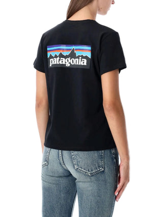 Person wearing a black Patagonia t-shirt with logo 
