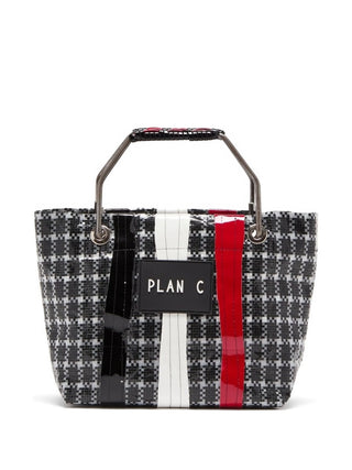 Plan C check-print tote bag in black and white with metal handle and logo patch. A structured everyday piece, available at our Lisbon store.