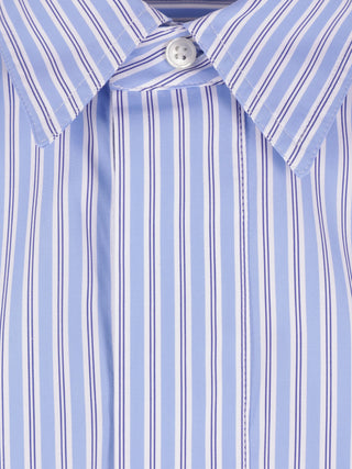 Close-up of a blue and white striped shirt with a button