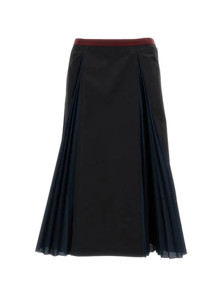 Black midi skirt with a red waistband and navy pleats