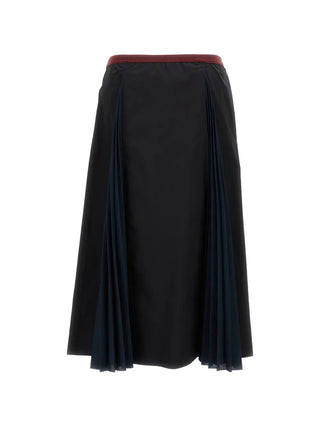 Black midi skirt with a red waistband and navy pleats by Plan C.
