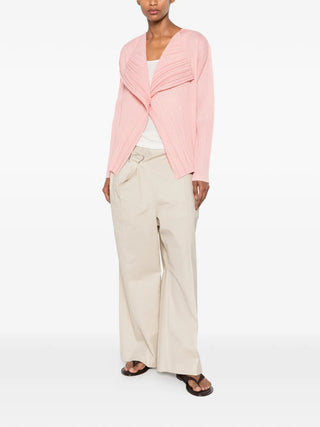 Pleats Please Issey Miyake pink pleated jacket with shawl collar, available at our Lisbon store.