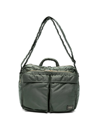 Porter-Yoshida & Co. green Tanker shoulder bag with padded design, logo patch and zip details. Functional everyday style, available at our Lisbon store.