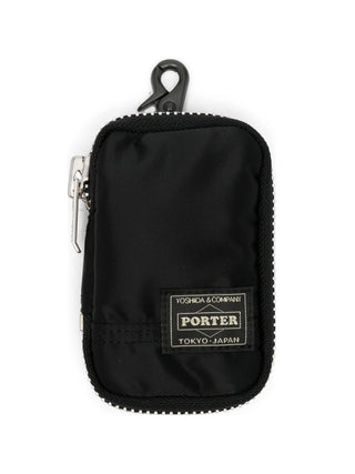 Porter-Yoshida & Co. green key pack with padded design, logo patch and zip details. Compact and functional, available at our Lisbon store.