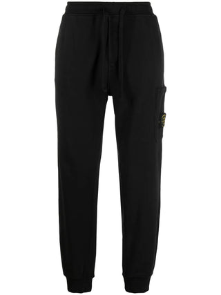 Track pants with the iconic detachable Compass badge. Cotton jersey, side pockets, and a modern tapered fit. Available at our Lisbon store. 