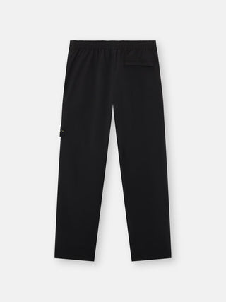 Logo track pants by Stone Island. Crafted from  a technical polyamide-elastane blend with a regular-fit for comfort and an iconic side badge.