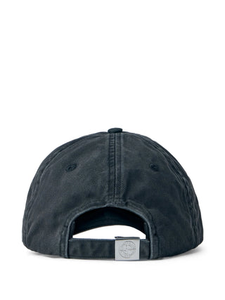Stone Island logo-embroidered baseball cap. Six-panel design in cotton, denim, or shell. Adjustable strap and signature branding. Available at our Lisbon store.